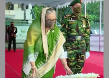 The Prime Minister pays homage to the portrait of Bangabandhu