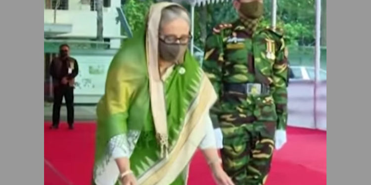 The Prime Minister pays homage to the portrait of Bangabandhu