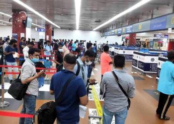 Passengers are standing in line, no one is at immigration