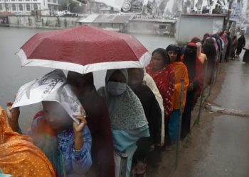 Voters rushing in the sudden rain, suffering