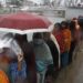 Voters rushing in the sudden rain, suffering